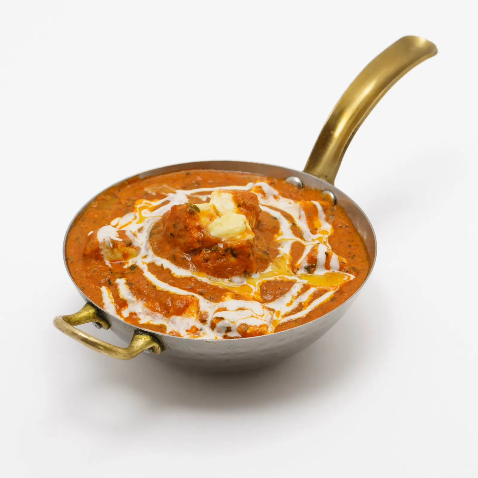 Butter chicken in a small copper pan